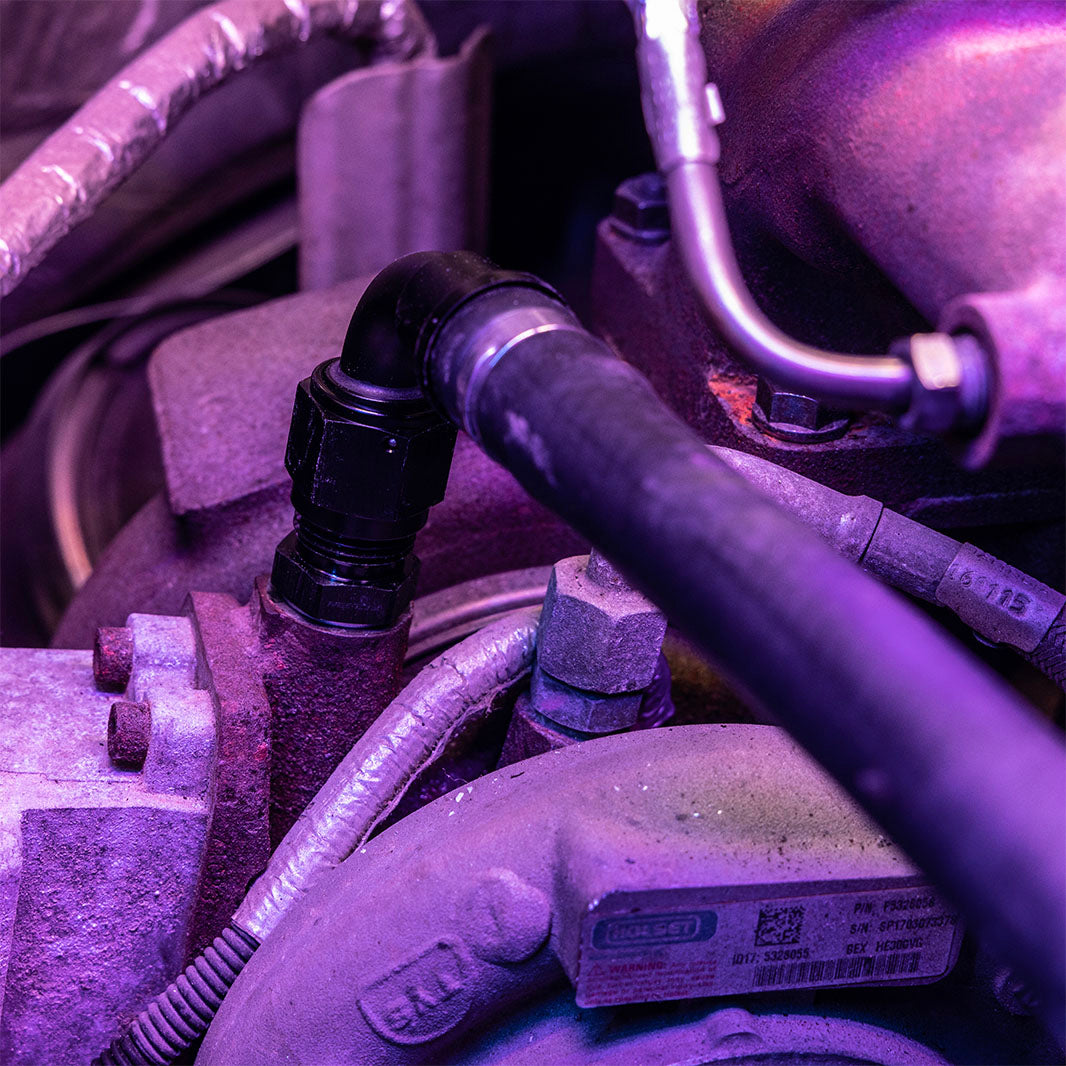 4th gen cummins turbo feed fitting riser with hose attached