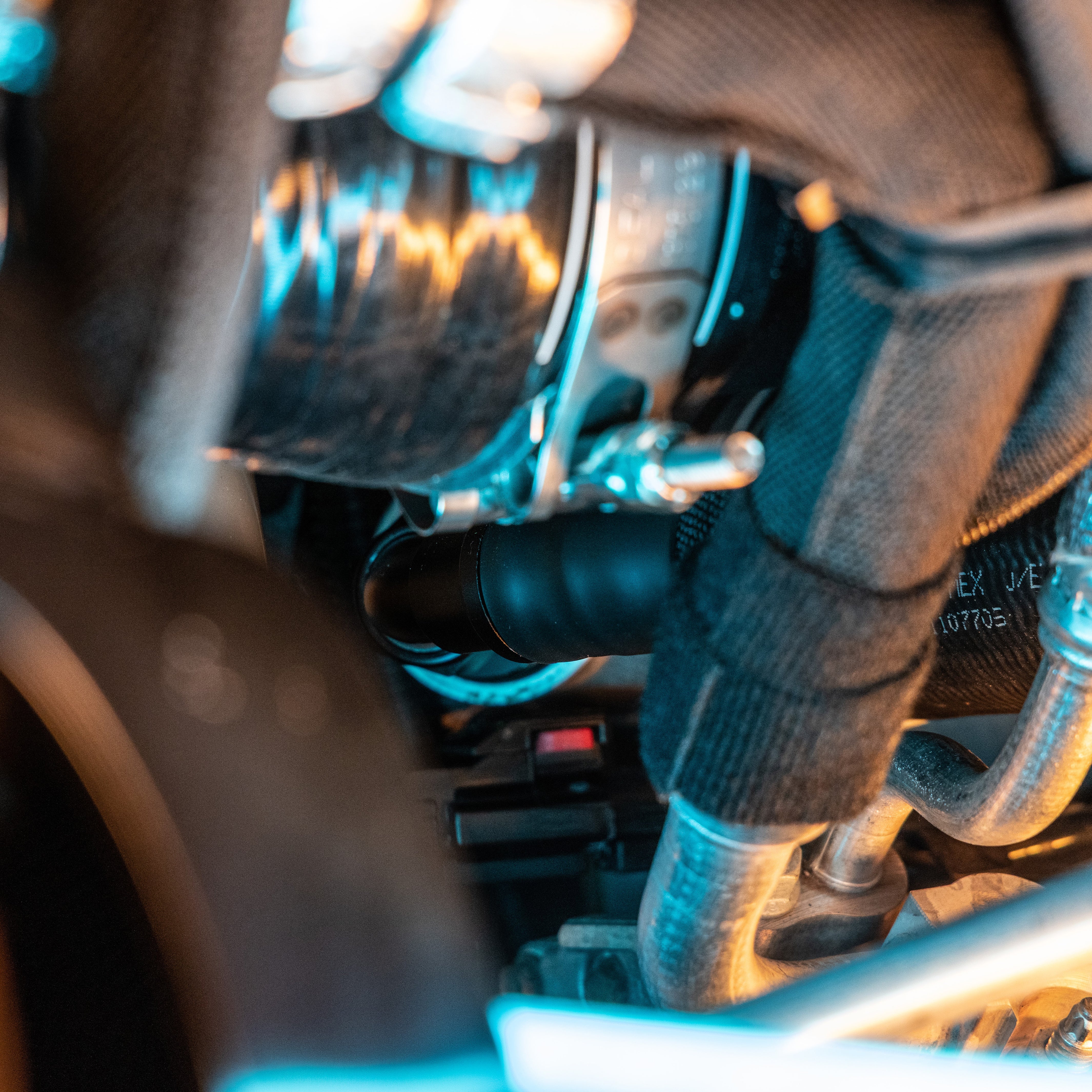 Close up of 5th gen cummins under turbo hose routing