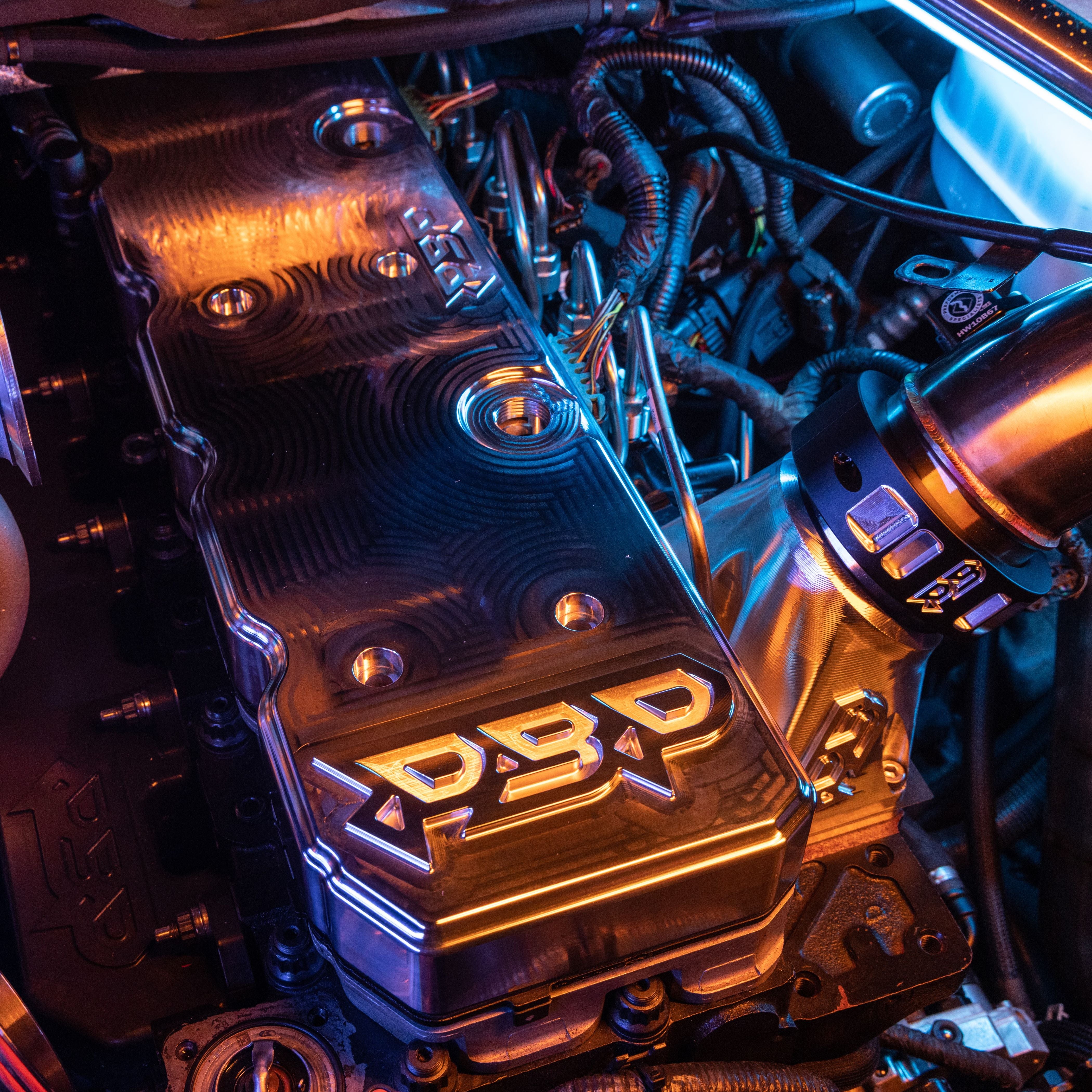6.7L Cummins Billet Valve Cover with Tapered Logo. Top Side View.