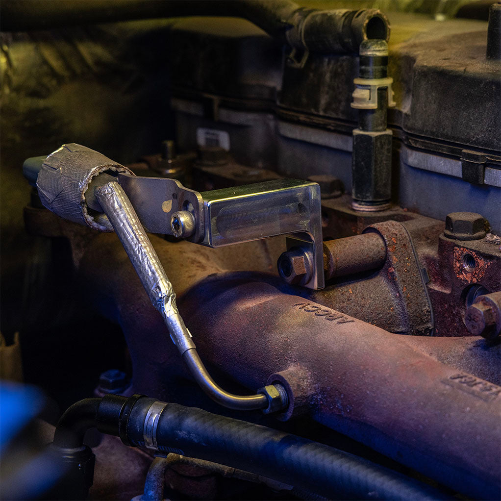Close up of a back pressure sensor bracket. Truck with an aisin transmission