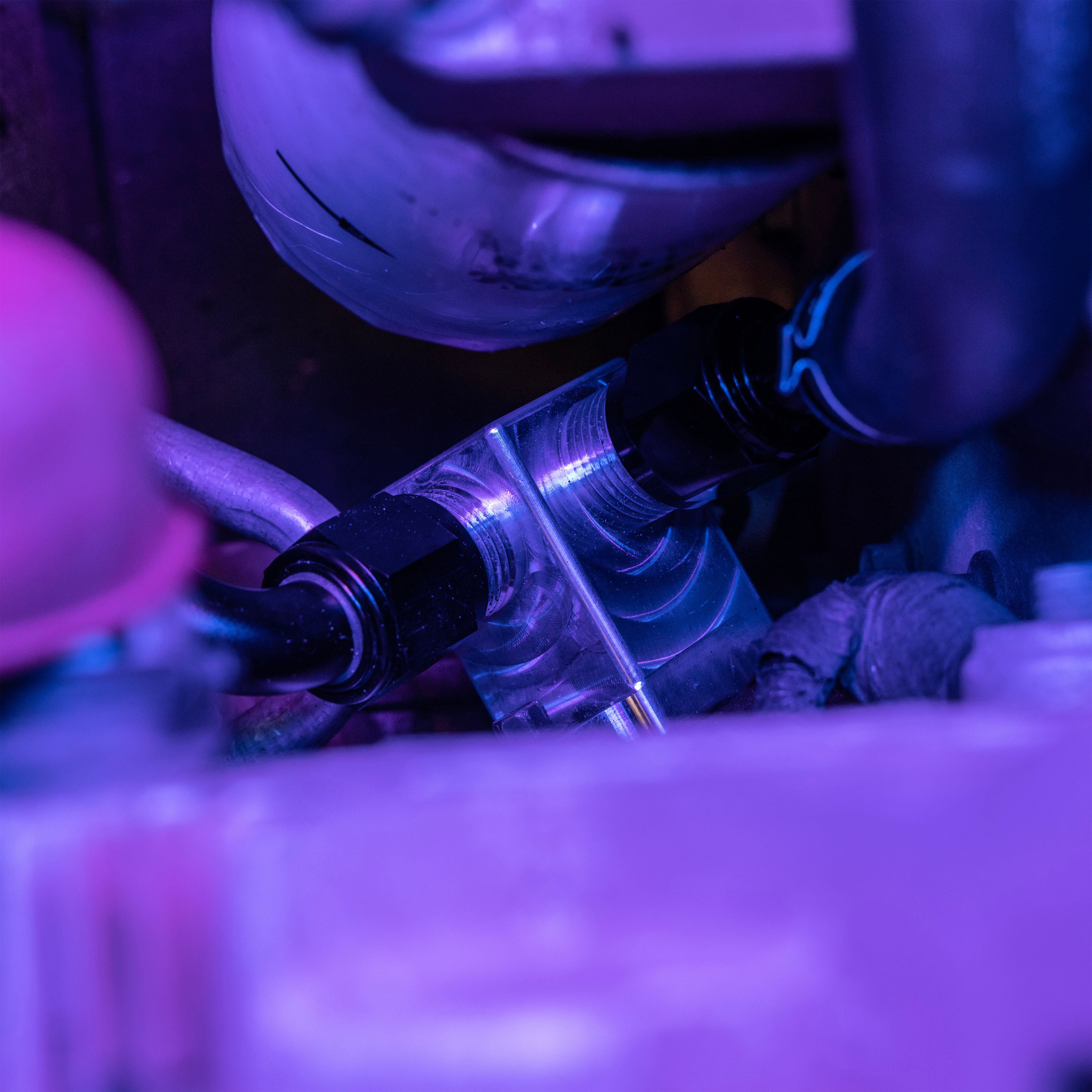 Close up of 4th gen coolant riser with attached spin on fittings