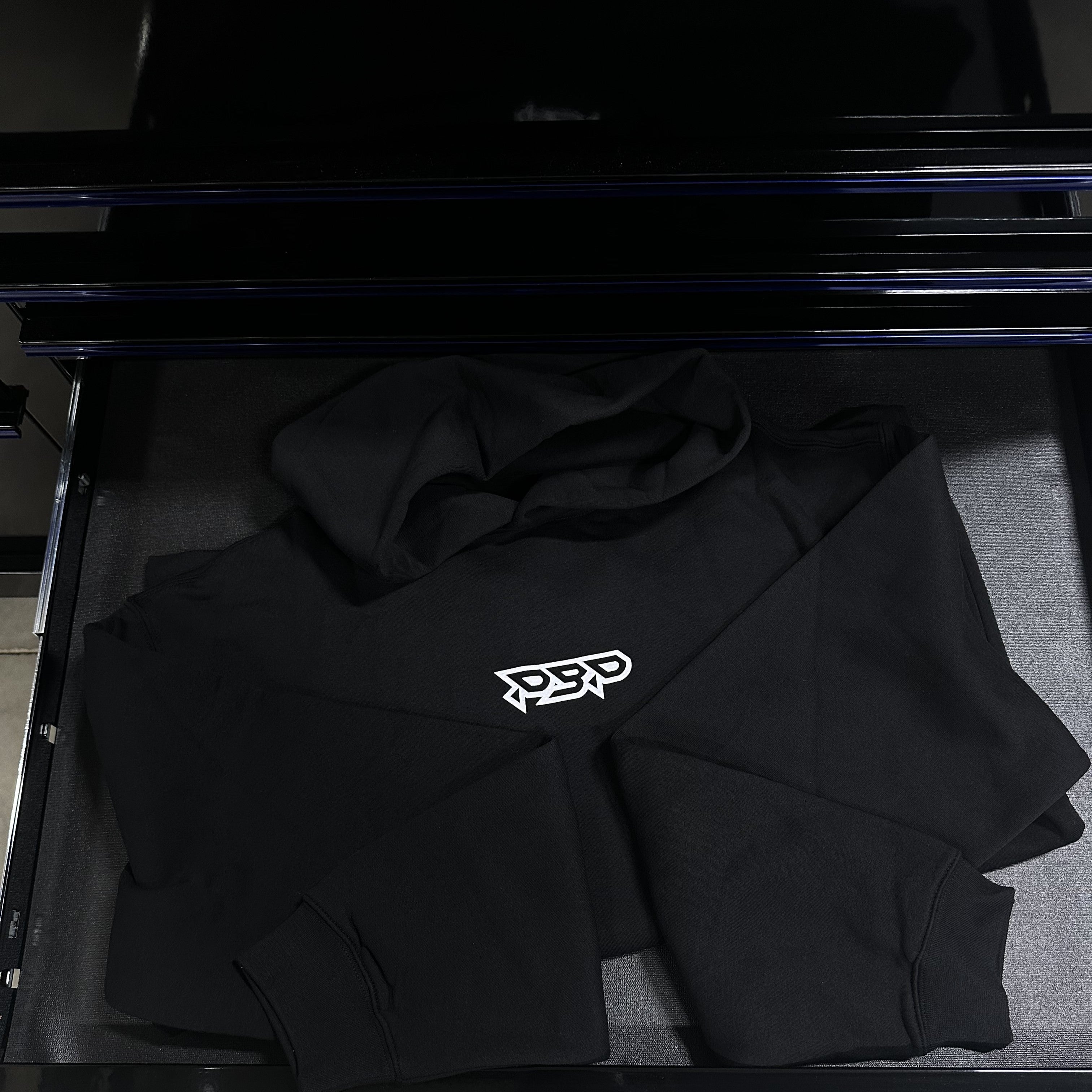 Black hoodie with pbp logo on front.