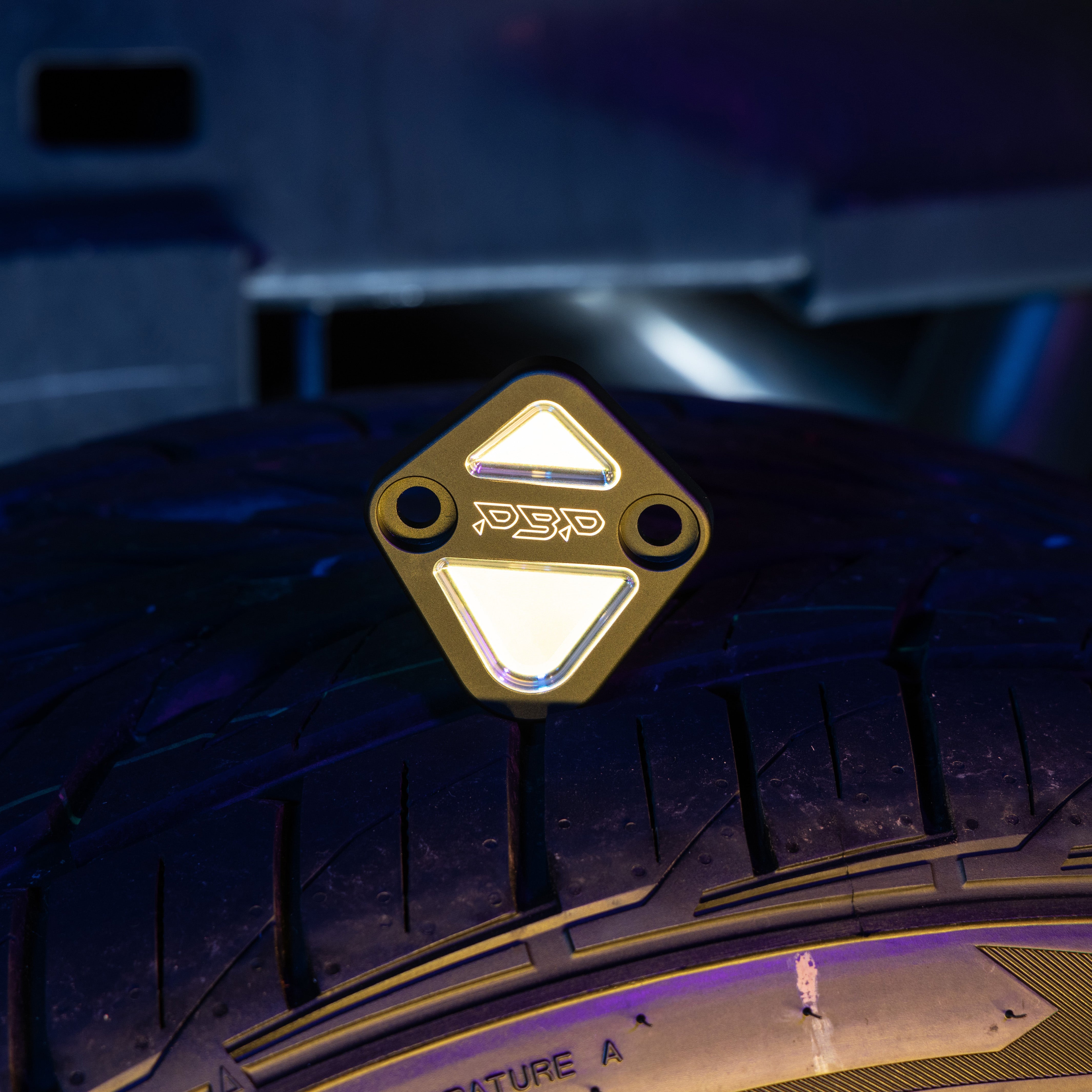 Cummins crankcase blockoff plate anodized black.