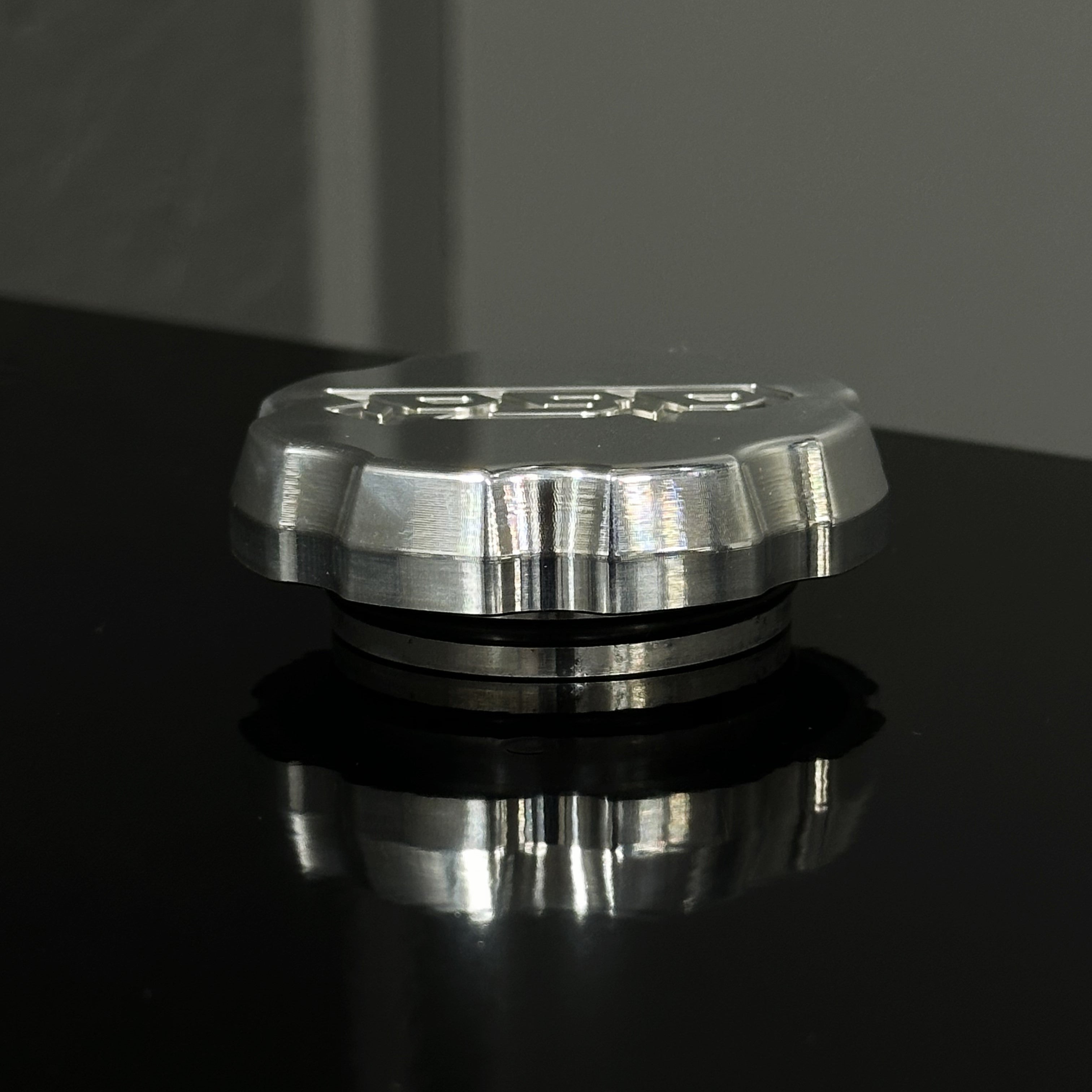 Cummins wiper fluid cap color raw billet side view