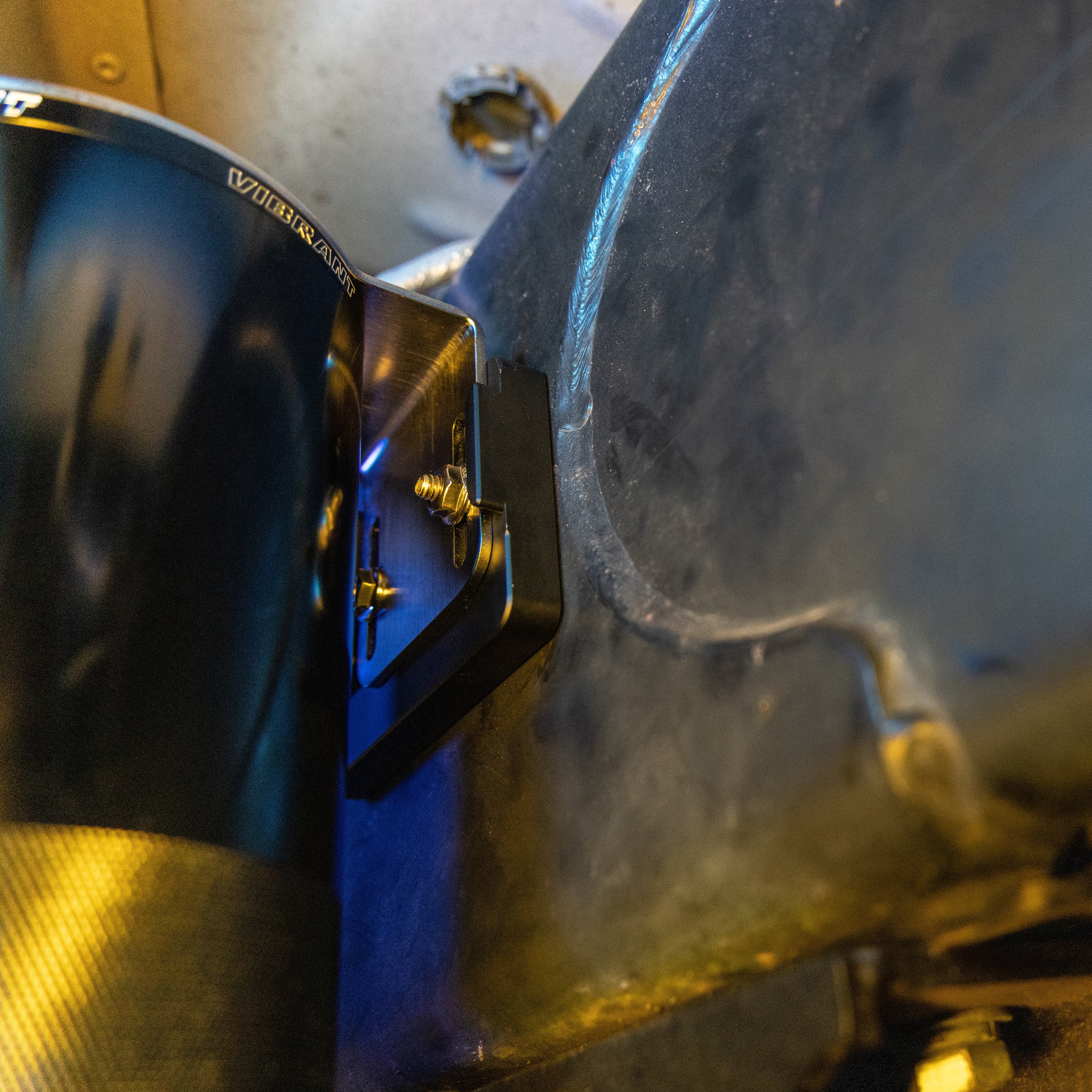 Powerstroke catch can bracket to frame. View of back side of catch can to bracket to frame